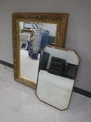 An Edwardian oak framed mirror and a gilt framed mirror