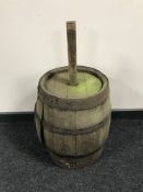 An oak coopered barrel in the form of an occasional table