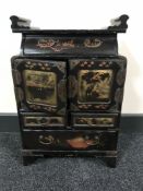 A Japanese Meiji period lacquered table cabinet fitted drawers
