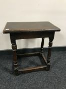 An early 20th century joined oak stool
