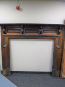 An antique oak fire surround