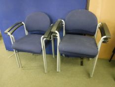 A set of four metal framed stacking office chairs and five stacking armchairs