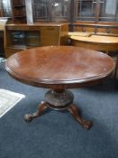 A Victorian mahogany pedestal tilt top breakfast table