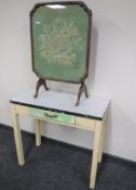 A mid 20th century kitchen table fitted a drawer and a tapestry table screen