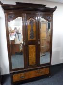 A Victorian mahogany and walnut double mirror door wardrobe