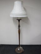 A twentieth century mahogany standard lamp
