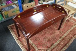 A mahogany butlers tray on stand