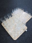 Two trays of cut glass tumblers,