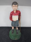 A late 20th century charity collection box in the form of a boy with crutch CONDITION