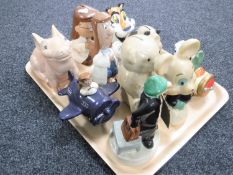 A tray of money boxes including Wade Andy Capp figure,