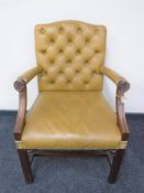 A mahogany Gainsborough style tan leather armchair