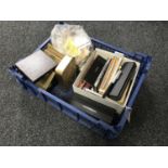 A crate containing fountain and other pens, matchbooks,