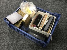 A crate containing fountain and other pens, matchbooks,