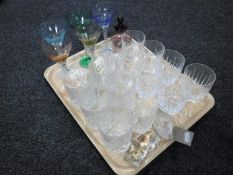 A tray of coloured glass champagne glasses,