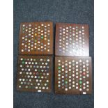 A large quantity of golfing studs mounted on four boards