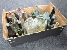 A box of antique glass bottles