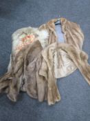 Three fur jackets together with a fur wrap