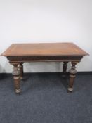 A late nineteenth century inlaid mahogany library table fitted a drawer