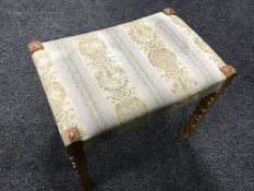 A blonde oak dressing table stool