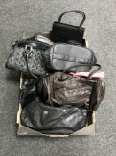 A box of various handbags