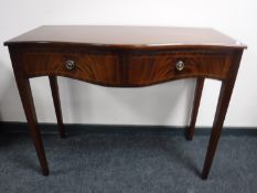 An inlaid mahogany serpentine fronted side table fitted two drawers