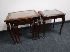A nest of three mahogany glass topped tables,