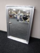 A silvered framed mirror