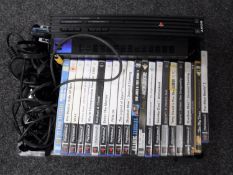 A box of Sony Playstation 2 and controllers,