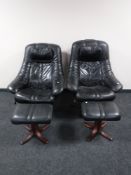 A pair of black leather adjustable swivel armchairs with stools