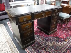 A late Victorian mahogany leather top writing desk,