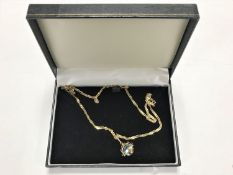 A 9ct gold necklace, 5.9g, together with a 9ct gold framed crystal swivel pendant.