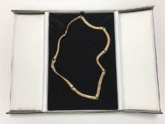 A 9ct gold fancy necklace, 25.8g.