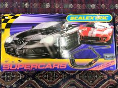 A boxed Scalextric Supercars set