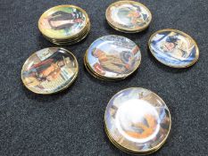 Twenty-four John Wayne collector's plates