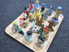 A tray of Wade salt and pepper sifters and other figures
