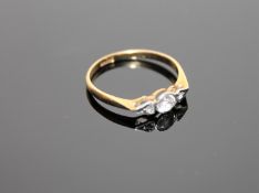 An 18ct gold ring set with paste stones, size L. CONDITION REPORT: 1.6g.
