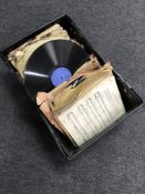 A crate of vinyl records and sheet music