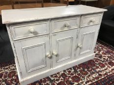 A painted pine triple door sideboard