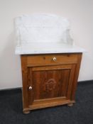 An antique pine marble topped wash stand