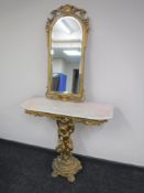 A gilt marble topped hall table on cherub support,