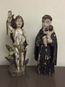Two antique religious carved figures,