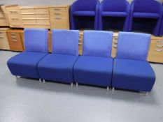 A set of four reception chairs in a blue fabric