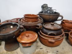 Two boxes of terracotta pots and bowls and an oil lamp
