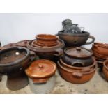 Two boxes of terracotta pots and bowls and an oil lamp