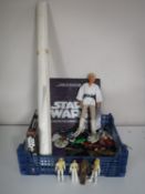 A basket of assorted Star Wars figures and collectables including a 12 '' Luke Sky Walker doll,