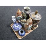 A tray of oriental wares to include lidded jar, vases, teapot,