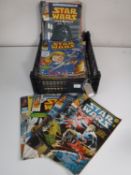 A basket of 1970's and later Star Wars Weekly comics