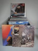 A box containing a quantity of LP's, Rock and 1980's including The Who, Rolling Stones, Gary Newman,