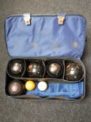 A Crown Green bowls bag containing five composite bowls