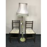 A pair of Edwardian oak bedroom chairs together with a standard lamp and shade